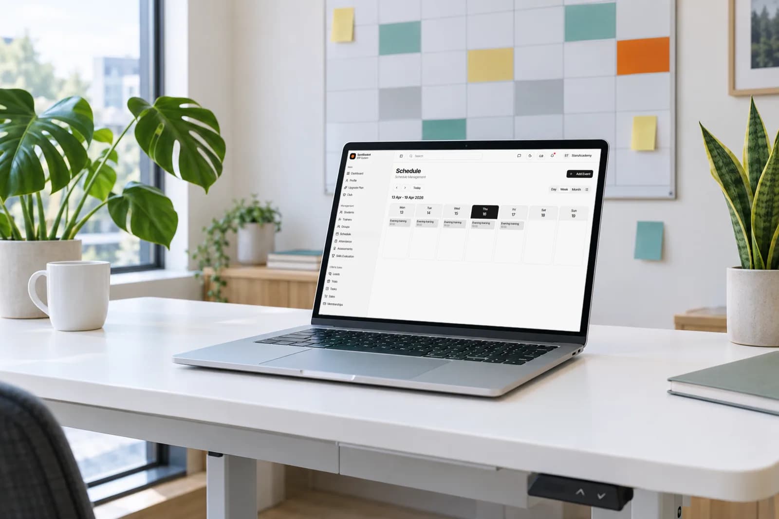 SpotBasket basketball team scheduling app showing a weekly practice calendar on a laptop